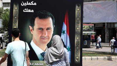 ملصقات دعائية لرئيس النظام السوري بشار الأسد في دمشق - أيار 2021 (AFP)