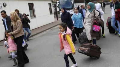 لاجئون السوريون في ألمانيا (رويترز)