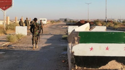 حاجز أمني لقوات النظام في محافظة درعا - رويترز