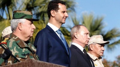 فلاديمير بوتين برفقة بشار الأسد في قاعدة حميميم العسكرية بسوريا