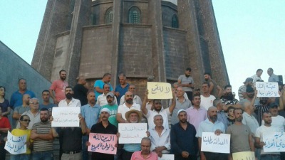 وقفة احتجاجية ضد النظام أمام ضريح سلطان باشا الأطرش، 18 آب 2023 (درع القريّا)