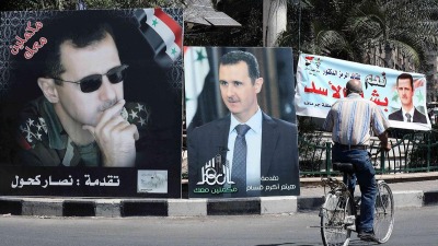 لافتات انتخابية مؤيدة لرئيس النظام السوري بشار الأسد في شوارع دمشق (Getty)