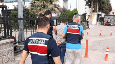 فرق الجندرما تنقل المشتبه به إلى قاعة المحكمة (İHA)