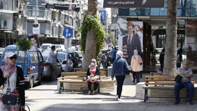 لافتات تحمل صورة رئيس النظام السوري بشار الأسد في شوارع العاصمة دمشق- أيار 2023 (AFP)